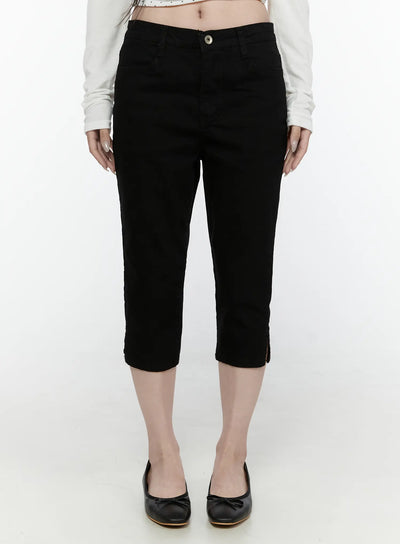 LEWKIN Slim Capri Pants IL521 Black Size S front view on model wearing white crop top and black ballet flats, cropped denim with button closure and hem slits