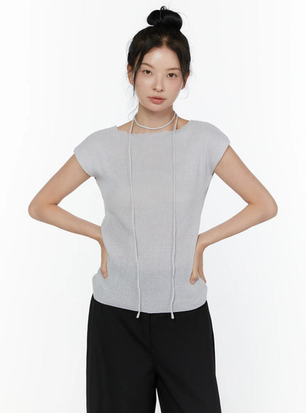 Slim Fit Boat Neck Knit Top CL520 Gray front close-up on model, showing ribbed knit texture, vertical seam detail, string choker neckline, and drawstring hem, paired with black wide-leg trousers