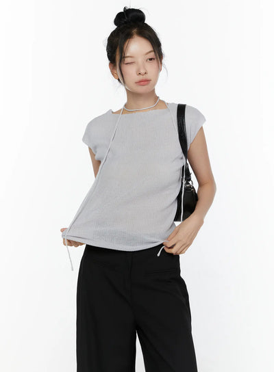 LEWKIN Slim Fit Boat Neck Knit Top CL520 Gray S/M front crop shot on model with bun updo, ribbed knit texture, string choker detail, side drawstring hem, styled with black wide-leg pants and black shoulder bag