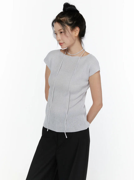 Slim Fit Boat Neck Knit Top CL520 Gray three-quarter front shot on model looking down, showing ribbed knit texture, vertical seam detail, asymmetric string choker neckline, and drawstring hem