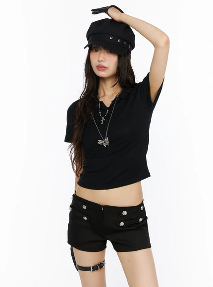Slim Fit Collared Tee CU530 Black front shot on model standing arm raised wearing newsboy cap chain necklaces showing open polo collar ribbed crop top