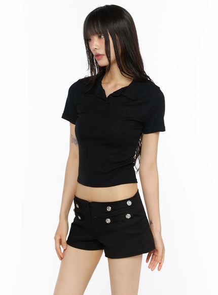 Slim Fit Collared Tee CU530 Black side shot on model showing ribbed fitted crop silhouette polo collar open-button neckline paired with low-rise shorts