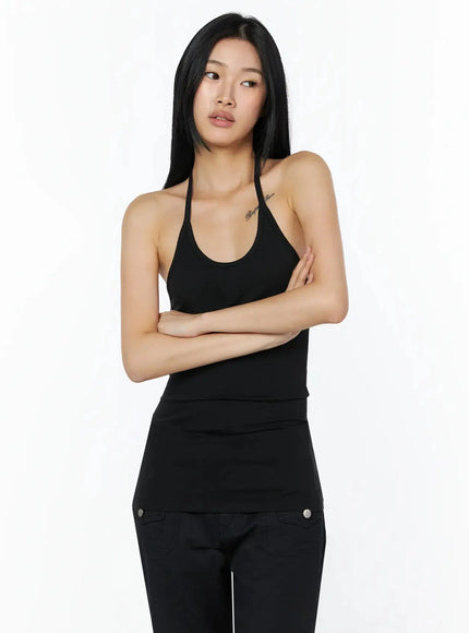 Slim Fit Halter Tank Top IL509 Black front close-up on model with arms crossed showing halter neck strap and scoop neckline detail