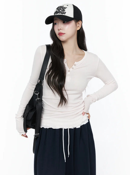 LEWKIN Slim-Fit Henly Neck Long Sleeve Tee IU525 Light pink front model shot with cap and black bag, ribbed slim fit, ruffle hem