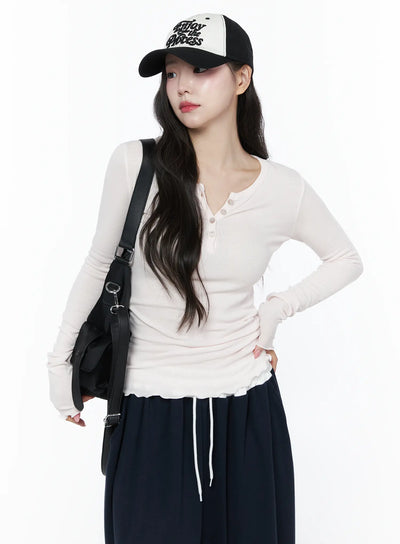 LEWKIN Slim-Fit Henly Neck Long Sleeve Tee IU525 Light pink front model shot with cap and black bag, ribbed slim fit, ruffle hem