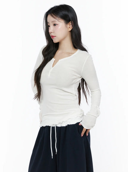 Slim-Fit Henly Neck Long Sleeve Tee IU525 white side model shot showing henley neckline, ribbed texture, ruffle drawstring hem, slim silhouette