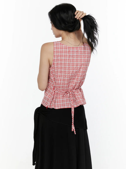 Slim Fit Plaid Sleeveless Top CL520 Red back shot on model gathering hair up showing back tie bow and gingham check fabric with black maxi skirt