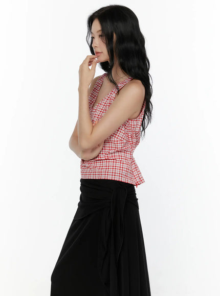 Slim Fit Plaid Sleeveless Top CL520 Red side profile shot on model hand near chin showing fitted silhouette and gingham check fabric