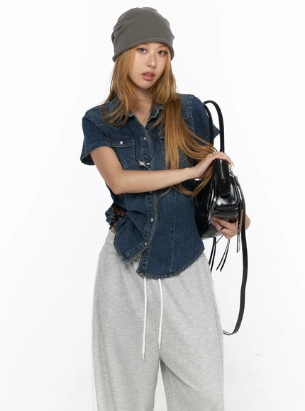 LEWKIN Slim Fit Wrinkle Wash Short Sleeve Jean Shirt CL528 Blue S front shot on model wearing grey beanie and grey sweatpants holding black bag