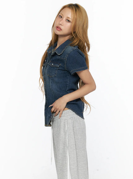 Slim Fit Wrinkle Wash Short Sleeve Jean Shirt CL528 Blue side shot on model showing fitted waist silhouette curved hem and washed denim texture