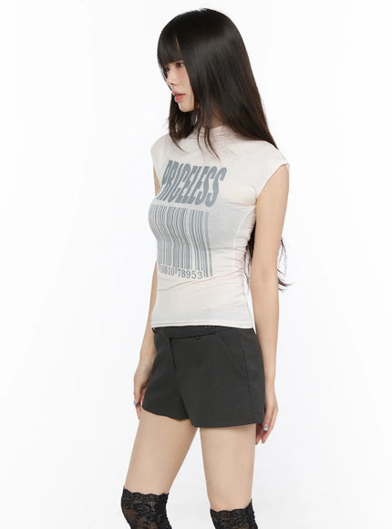 Slim Mock Neck Sheer Graphic Tee CL523 Light pink angled front shot on model with PRICELESS barcode graphic sheer layered mesh fabric detail