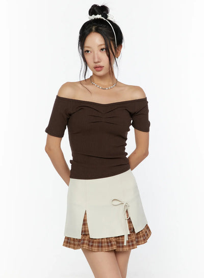 LEWKIN Slim Off-Shoulder Top CU526 Brown front view on model wearing bun updo with pearl necklace, ribbed knit off-shoulder ruched chest detail, size S/M