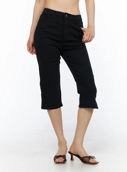 Slit Cotton Capri Trousers CL502 Black front close-up on model showing high waist, button closure, and front pockets