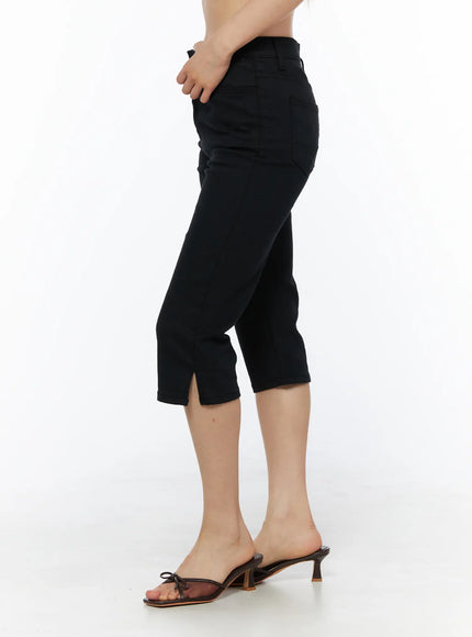 Slit Cotton Capri Trousers CL502 Black side view on model revealing slim silhouette, side seam, and hem slit detail