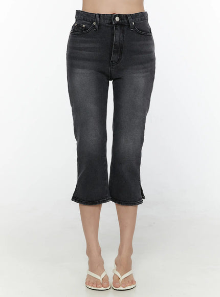Slit Detail Capri Jeans CL521 washed black front view on model standing showing high-rise fit flared cropped leg slit hem and white flip-flops