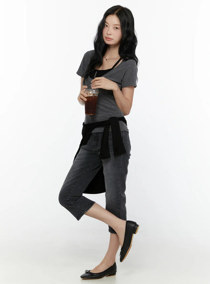 Slit Detail Capri Jeans CL521 washed black side view full-body on model styled with grey tee black cardigan at waist holding iced drink