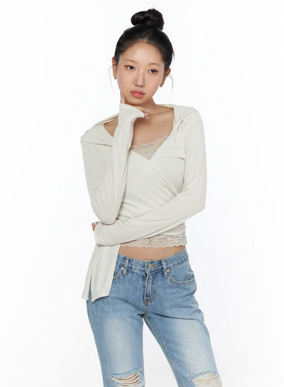 LEWKIN Soft Hooded Wrap Cardigan CL513 Beige S/M front shot on model with bun updo, cross-wrap lace-trim crop top, ribbed knit, styled with ripped jeans