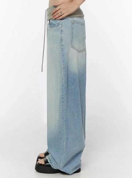 Solene Vintage Washed Foldover Baggy Jeans IU524 Blue side close-up on model showing right side pocket back pocket foldover waistband drawstring and wide-leg hem