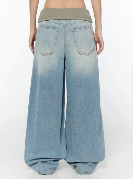 Solene Vintage Washed Foldover Baggy Jeans IU524 Blue back close-up on model showing two large back pockets khaki ribbed foldover waistband and faded wash texture