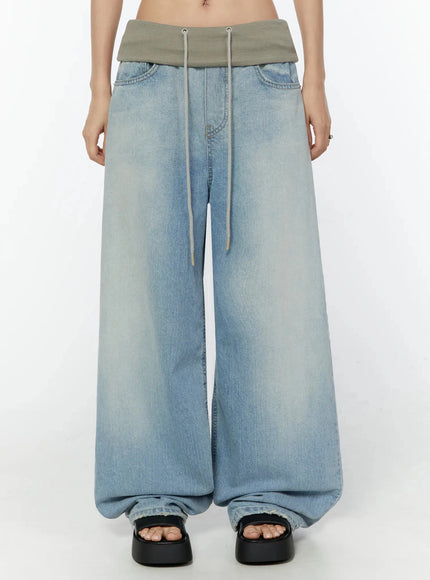 LEWKIN Solene Vintage Washed Foldover Baggy Jeans IU524 Blue front crop shot on model showing oversized wide-leg silhouette with khaki ribbed foldover waistband and drawstring