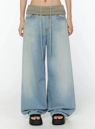LEWKIN Solene Vintage Washed Foldover Baggy Jeans IU524 Blue front crop shot on model showing oversized wide-leg silhouette with khaki ribbed foldover waistband and drawstring