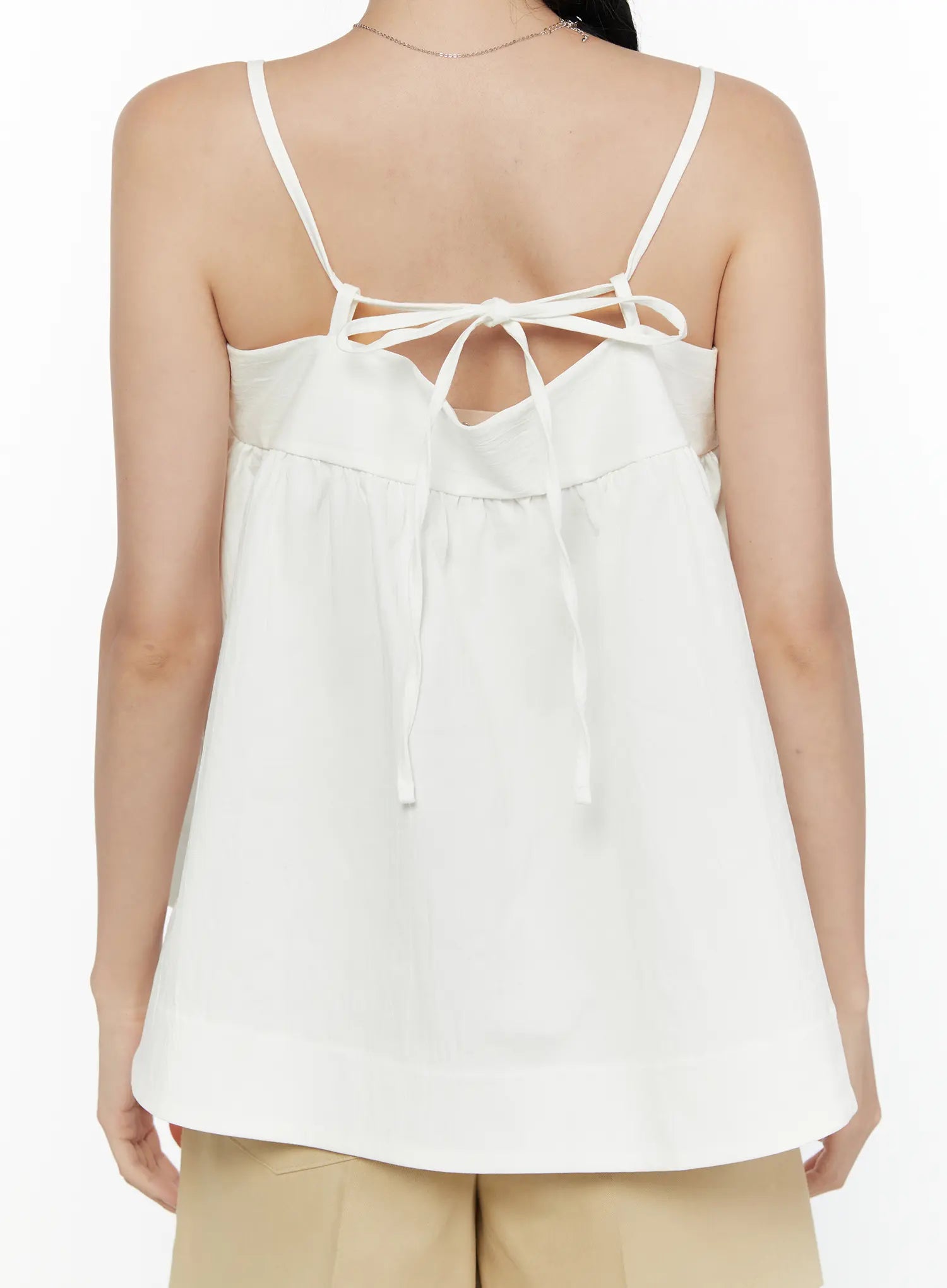 Square Neck Babydoll Cami Top CL520 White close-up back shot on model showing open-back tie bow detail and spaghetti straps