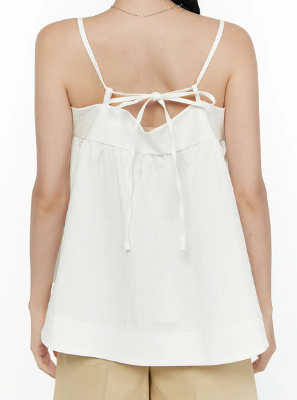 Square Neck Babydoll Cami Top CL520 White close-up back shot on model showing open-back tie bow detail and spaghetti straps
