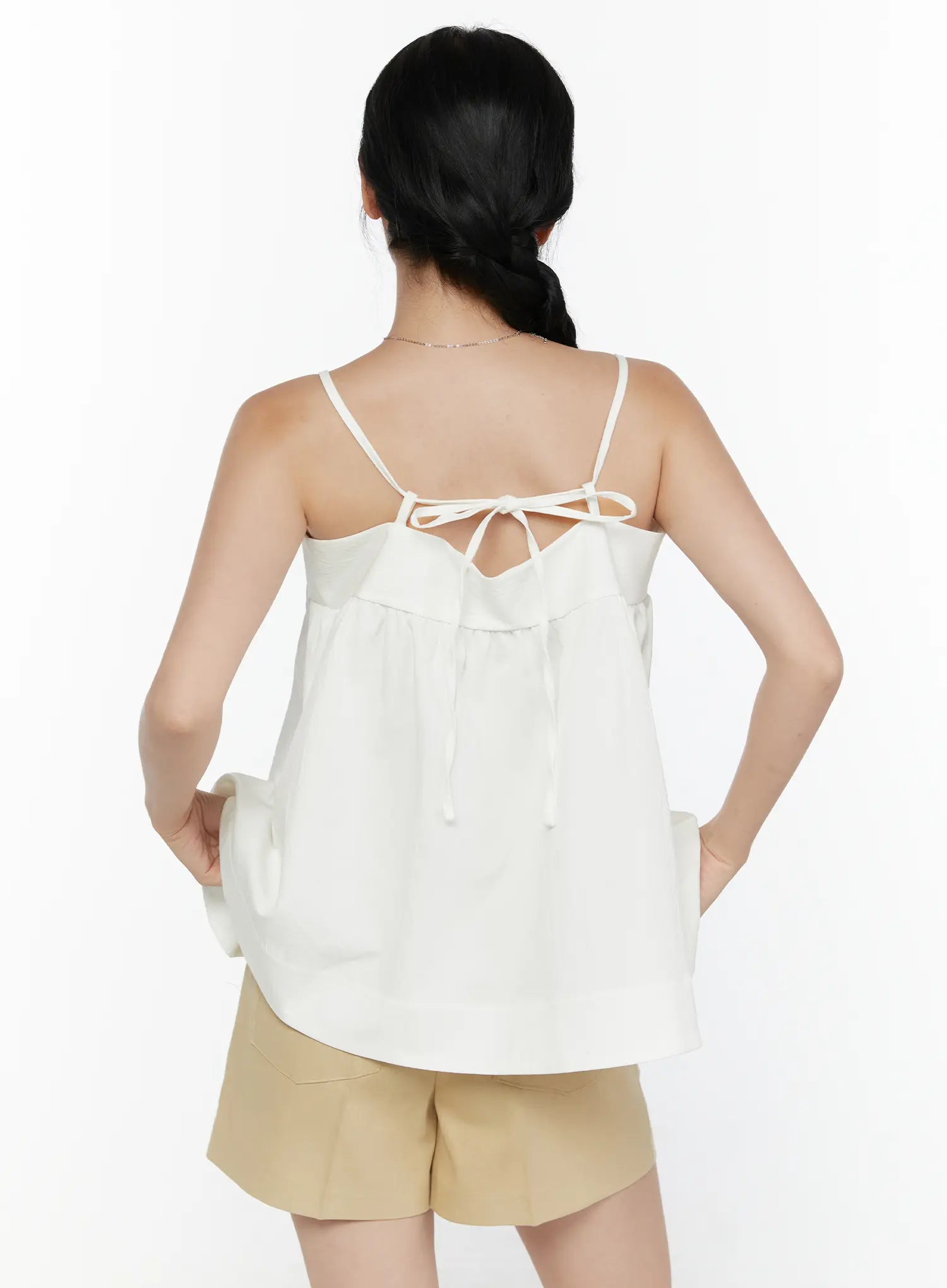 Square Neck Babydoll Cami Top CL520 White back shot on model showing full back tie bow closure, gathered skirt panel, and flowy A-line hem