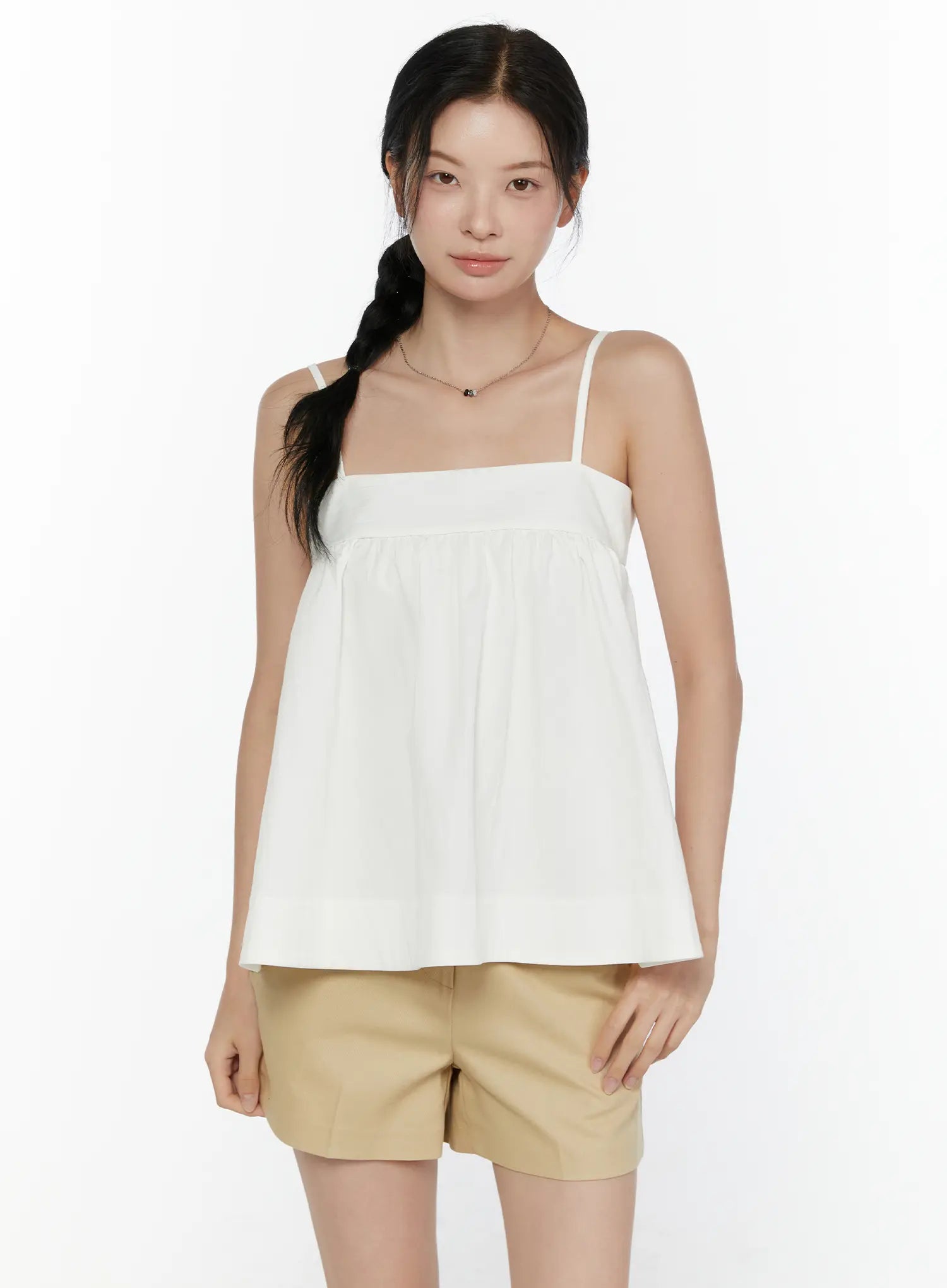 Square Neck Babydoll Cami Top CL520 White close-up front shot on model showing square neckline, gathered bust seam, and flared silhouette