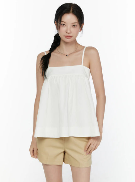 Square Neck Babydoll Cami Top CL520 White close-up front shot on model showing square neckline, gathered bust seam, and flared silhouette
