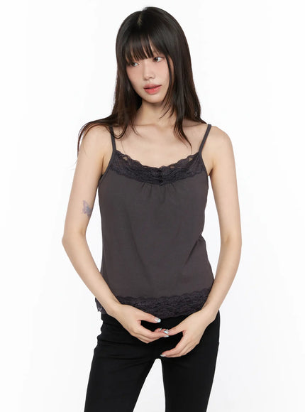 Square Neck Lace Tank CL522 Dark beige front shot on model with hands clasped, lace square neckline and scalloped lace hem, styled with black pants