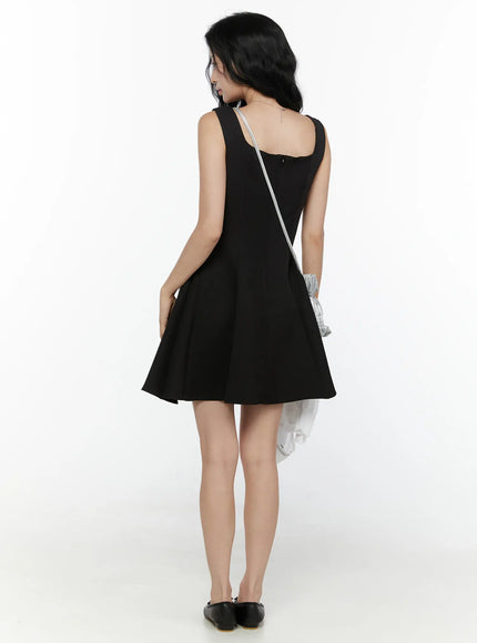 Square Neck Mini Dress CL521 Black back full-body styled shot on model with silver ruched crossbody bag and black ballet flats