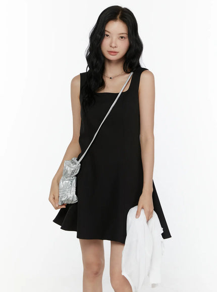 LEWKIN Square Neck Mini Dress CL521 Black front half-body shot on model styled with silver crossbody bag and white jacket, S/M