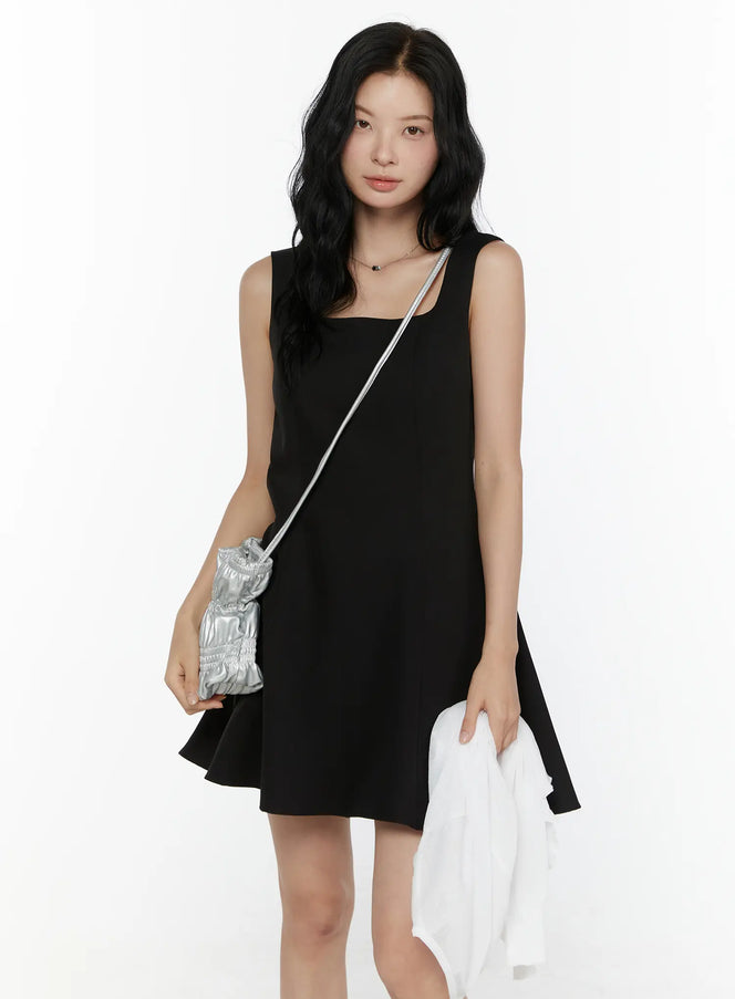LEWKIN Square Neck Mini Dress CL521 Black front half-body shot on model styled with silver crossbody bag and white jacket, S/M