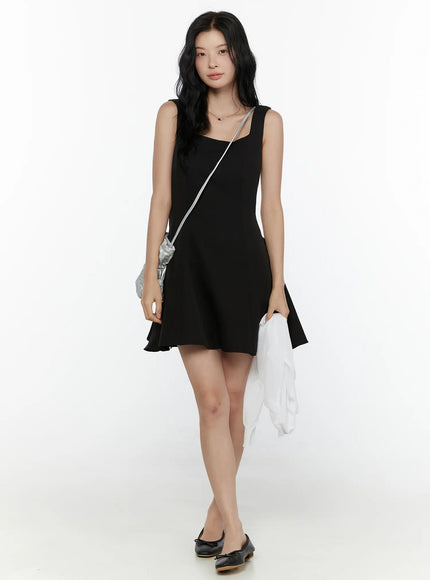 Square Neck Mini Dress CL521 Black full-body front shot on model wearing black bow ballet flats with silver bag and white jacket