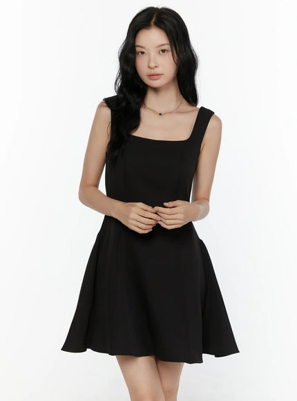 Square Neck Mini Dress CL521 Black front close-up shot on model showing square neckline, wide straps, and flared A-line skirt