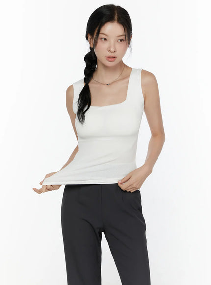 Square Neck Padded Ribbed Tank Top CL520 White close-up front model lifting hem to show stretch ribbed texture and square neckline detail
