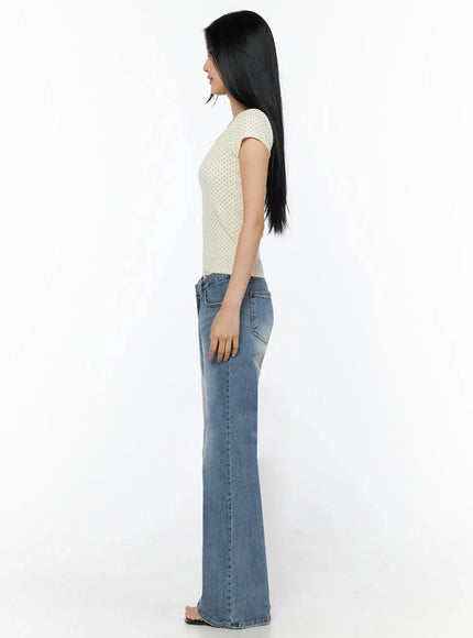 Square Neck Polka Dot Slim Tee IL509 Light beige side shot model standing profile view showing slim cap sleeve silhouette and cropped hem with flare jeans
