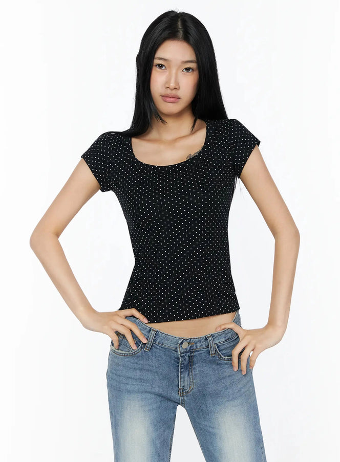 Square Neck Polka Dot Slim Tee IL509 Black front shot model standing hands on hips showing scoop neckline and cap sleeves paired with blue jeans