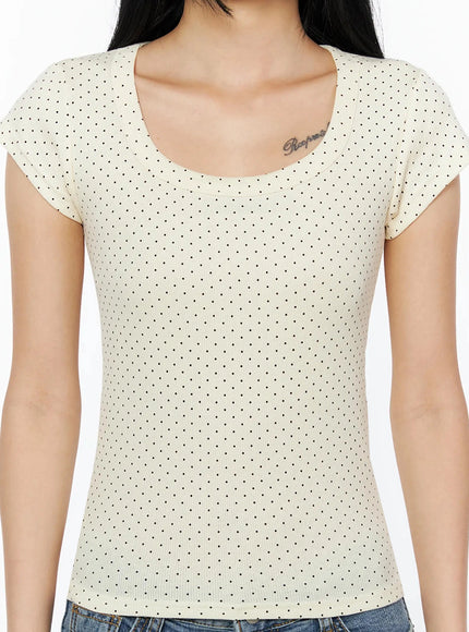 Square Neck Polka Dot Slim Tee IL509 Light beige close-up front shot model showing scoop neckline ribbed fabric black polka dot pattern and cap sleeve detail
