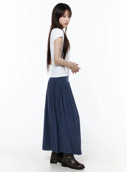 Square Neck Short Sleeve Tee IL502 White side shot on model looking back over shoulder, fitted silhouette with cap sleeves, paired with navy maxi skirt and brown boots
