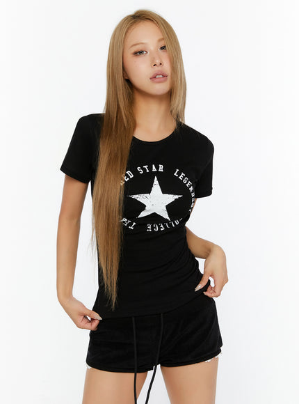 Star Graphic Slim-Fit Tee IL524 Black front shot on model with white star graphic print crew neck short sleeve slim-fit tee paired with black shorts
