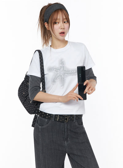 LEWKIN Star Graphic Tee IU525 White S/M front model shot with star print layered over gray long-sleeve tee styled with dark jeans and studded bag