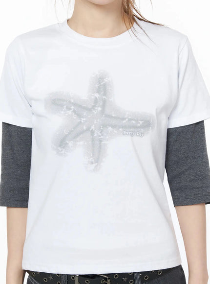 Star Graphic Tee IU525 White close-up front detail shot highlighting halftone star graphic print with Every Day text on cotton fabric layered over gray tee