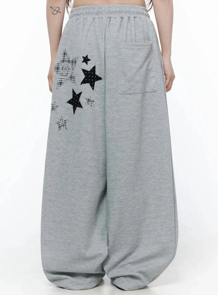 Star Graphic Wide Leg Sweatpants IL506 Gray back close-up on model showing full star appliqué arrangement and back patch pocket on wide leg