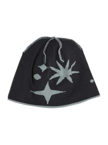 Star Knit Beanie IL506 Charcoal flat product shot, dark charcoal knit beanie laid flat showing sage green starburst intarsia pattern with exposed overlock seam at crown