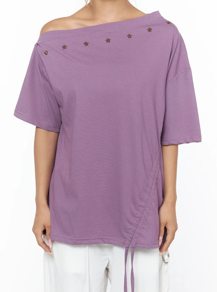 Star Studded Asymmetric Drawstring Tee CU524 Purple close-up front torso shot on model showing bronze star studs along asymmetric neckline and side ruched drawstring hem in cotton fabric