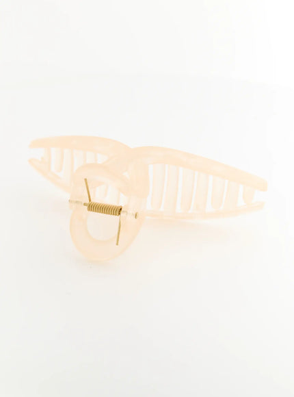 Stella Litter Hair Clip IL503 beige detail shot from below showing open jaw position with gold coil spring mechanism and ribbed claw teeth