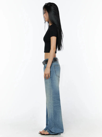 Stretch Crop Tee IL509 Black side shot on model showing slim crop silhouette short sleeve and midriff length styled with wide-leg low-rise blue jeans