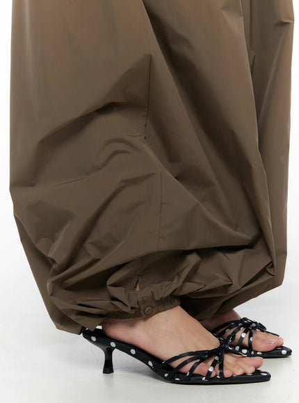 String Detail Parachute Pants CU524 Brown close-up detail of voluminous ballooned hem with elastic cuff and gathered ankle